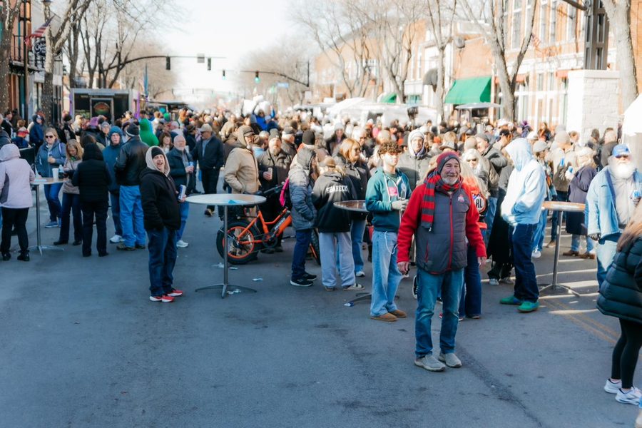 Crowd filling Conant Street between the stages